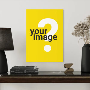 vertical wooden poster mockup with yellow background displayed on dark shelf styled with black table lamp books and decorative vase in modern interior setting