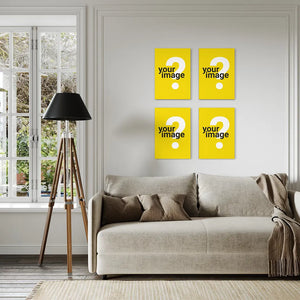 set of four vertical wooden posters arranged as gallery wall above grey sofa with tripod floor lamp and french windows in modern living room interior